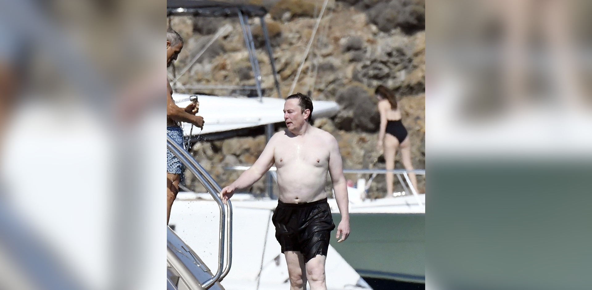 Elon Musk with his pale white skin vacation somewhere on a boat
