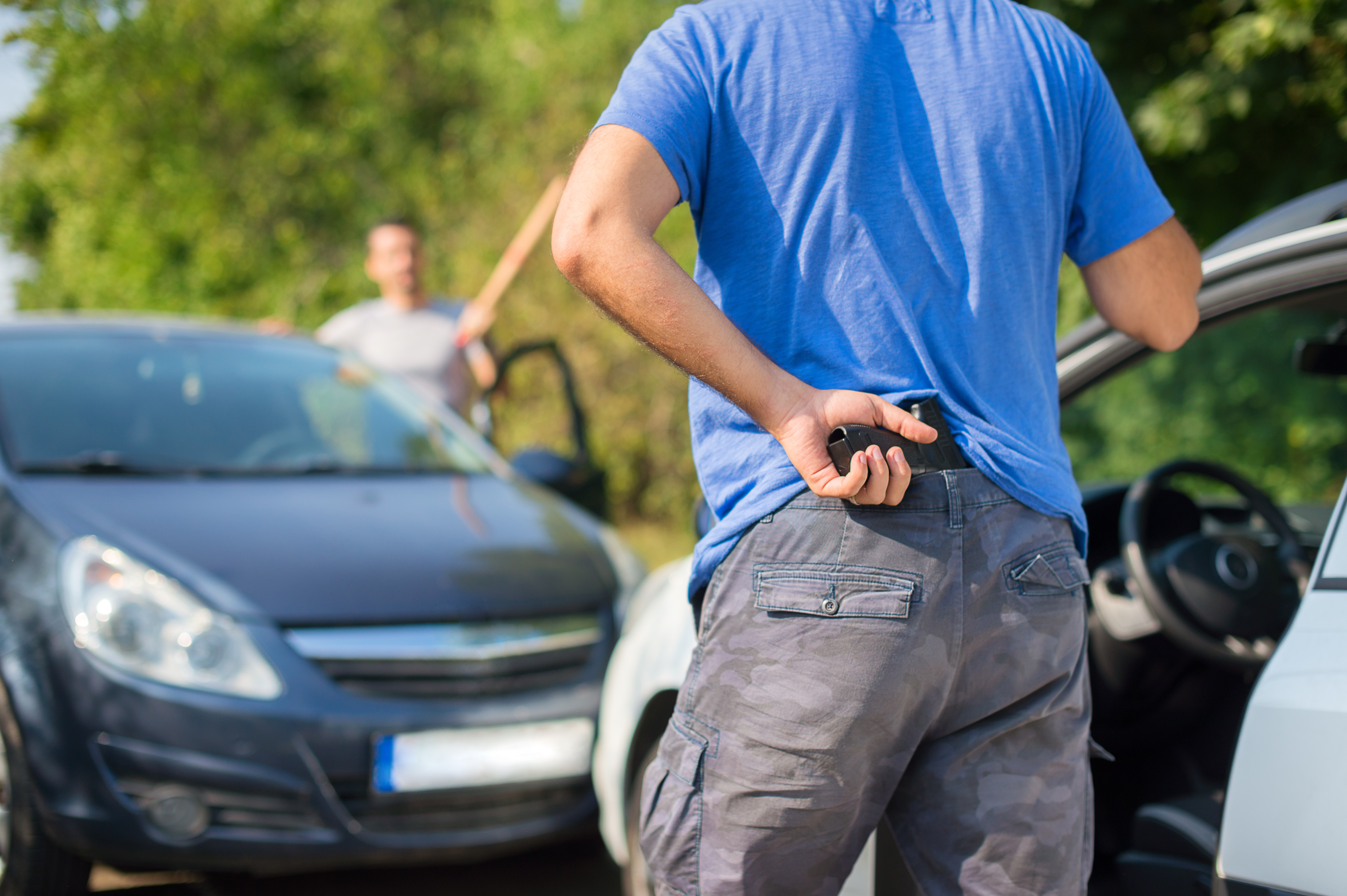 Road Rage - man with gun and man with bat