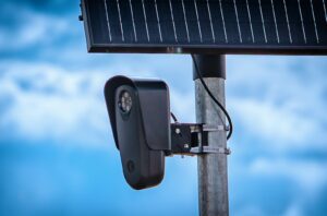 A Flock Safety automated license plate reader camera mounted on a roadside pole