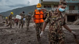 Rescuers pump air into hydropower tunnel in search for missing workers after Nepal