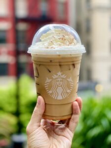 An iced pumpkin spice latte, one of the small daily habits creators list in the 'How to kidnap me' trend