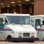 USPS mail carrier trucks; a federal judge canceled her own nationwide order blocking postal work on Trump's mail-in voting directive