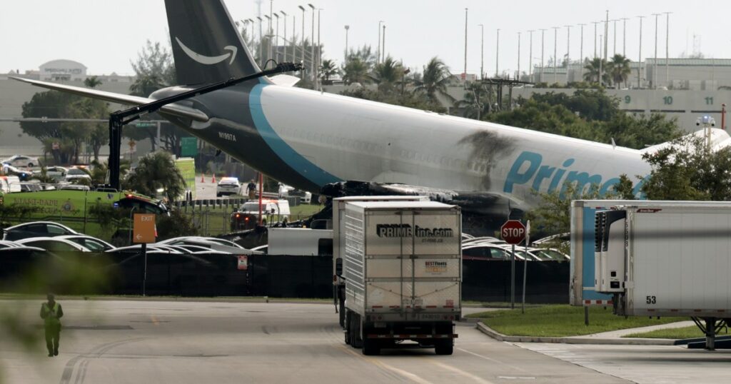 Amazon-branded cargo plane overruns runway at Miami airport, strikes multiple vehicles