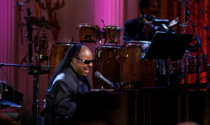 Stevie Wonder performing on stage