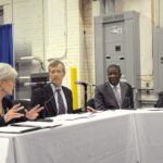 A federal health official meets with small business owners to discuss Affordable Care Act marketplace coverage options