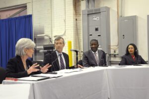 A federal health official meets with small business owners to discuss Affordable Care Act marketplace coverage options
