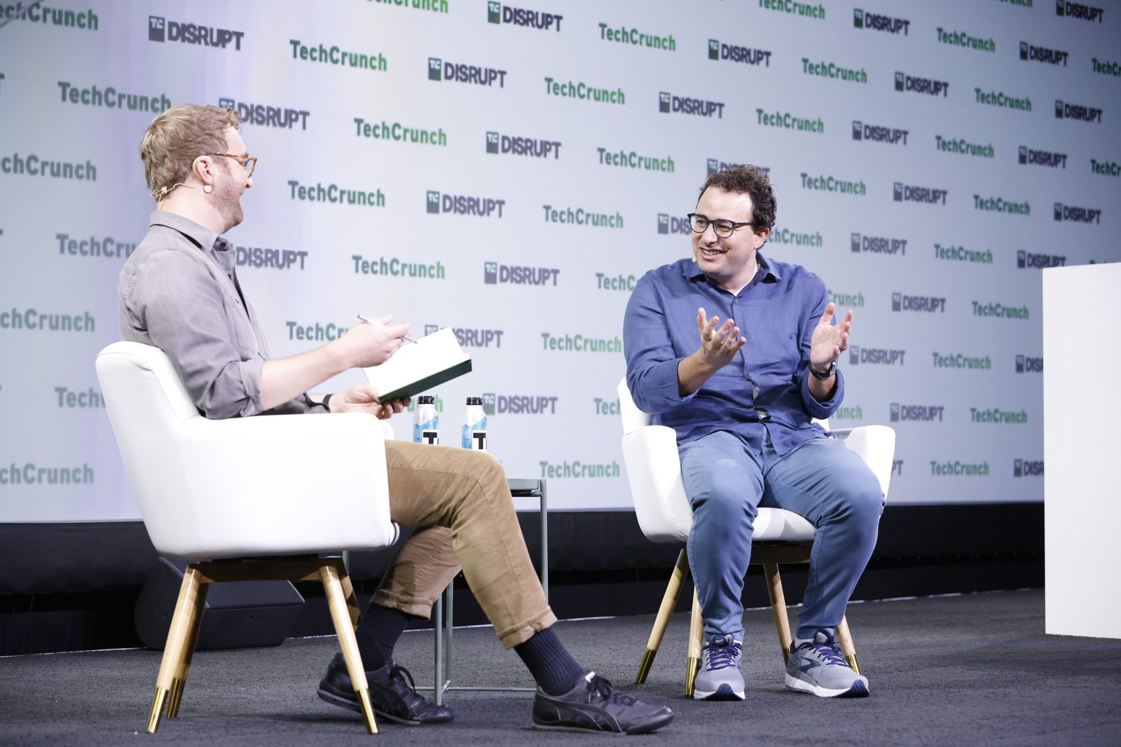 Anthropic CEO Dario Amodei speaking on stage at a technology conference