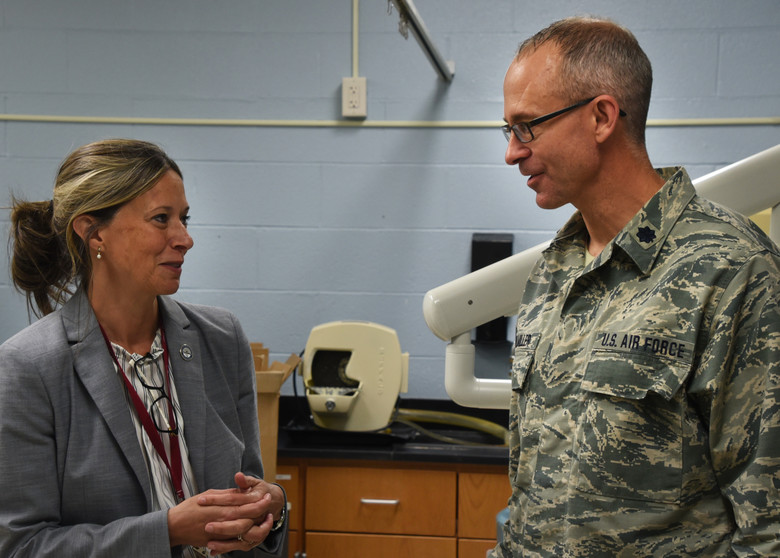 Amy Acton speaking with a National Guard dentist at a community health event