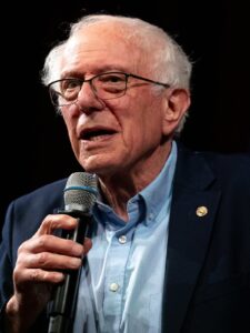 Senator Bernie Sanders speaking at a lectern about AI governance
