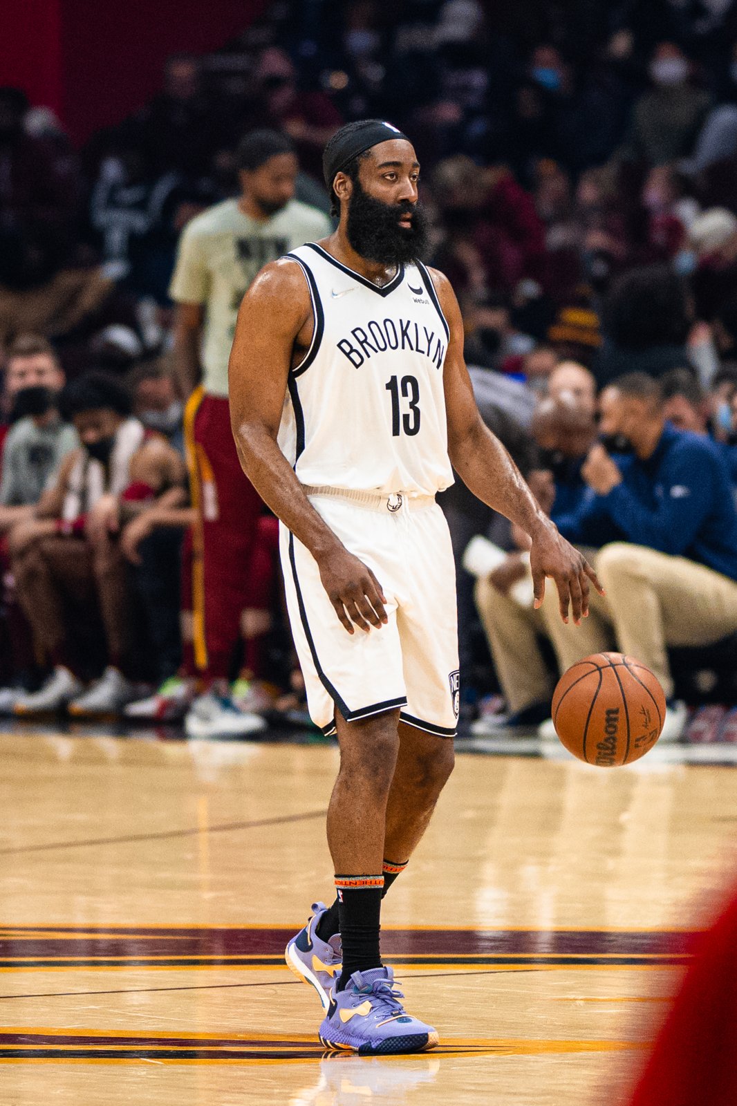 James Harden dribbling the ball during a Cleveland Cavaliers game