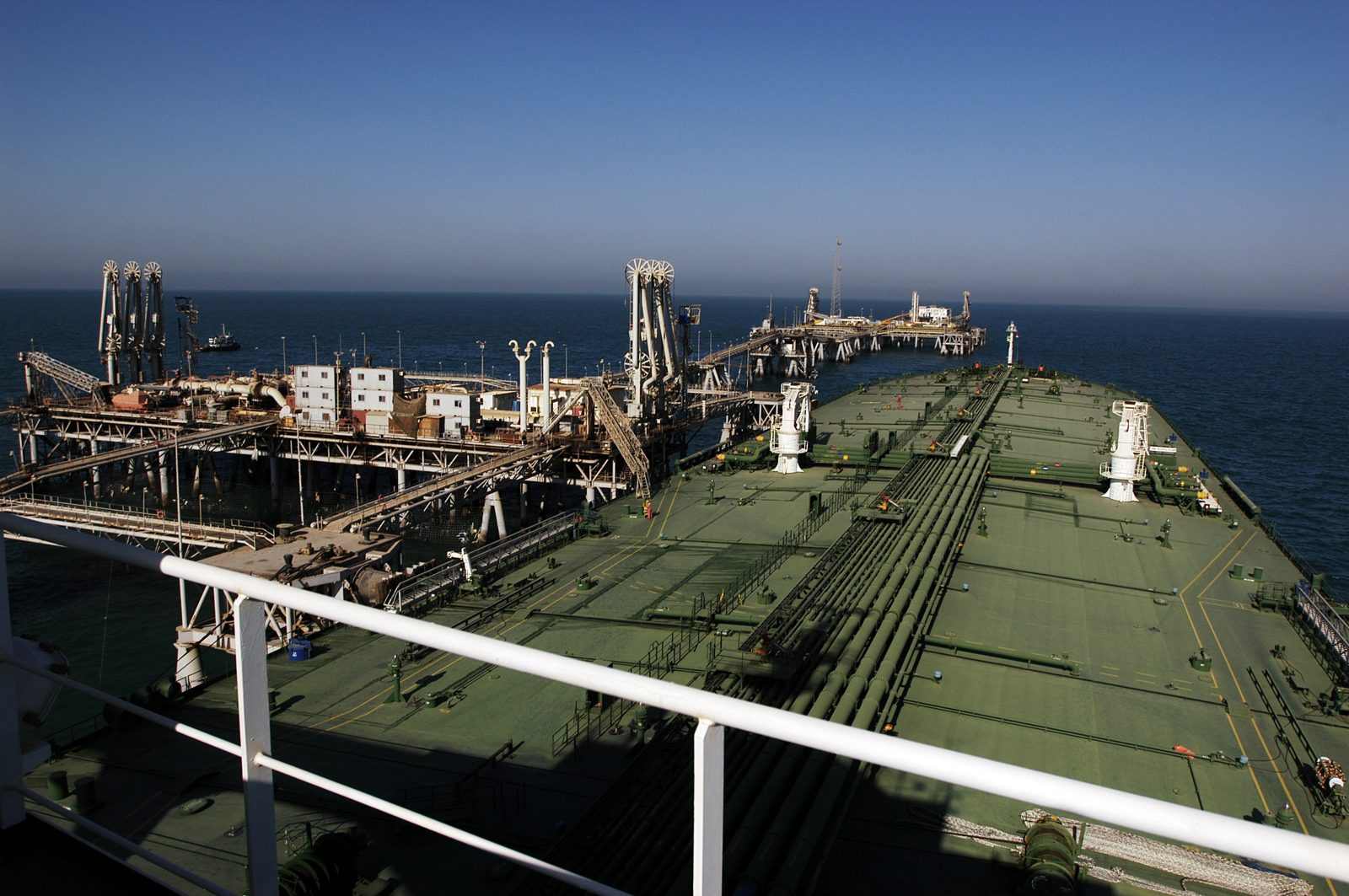An oil tanker docked at a terminal taking on crude oil in the Persian Gulf