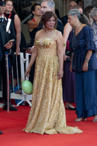 A filmmaker on the red carpet at the Venice International Film Festival